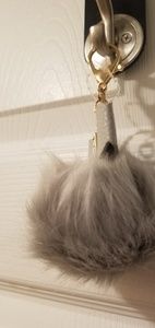 Brand New pompom key chain with rhinestones.